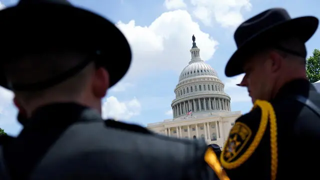 epa12103786 Police officers attend the National Police Officers' Memorial Service at the US Capitol, Washington, DC, USA, 15 May 2025. The Service is organised by the National Fraternal Order of Police and honors 232 law enforcement officers who have died in the line of duty in 2024. EPA/WILL OLIVER
