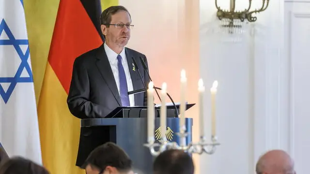 epa12094967 Israeli President Isaac Herzog gives a speech before a festive dinner in honor of the 60th anniversary of the establishment of diplomatic relations between the Federal Republic of Germany and Israel at Bellevue Palace in Berlin, Germany, 12 May 2025. President Herzog and Michal Herzog attended the event, which was hosted by German President Frank-Walter Steinmeier and Elke Budenbender, marking the anniversary of the establishment of diplomatic relations between Germany and Israel on 12 May 1965. EPA/ANDREAS GORA / POOL