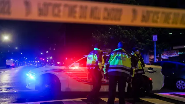 epa12124456 Police officers on the scene where two people were shot and killed near the Capital Jewish Museum in Washington, DC, USA, 22 May 2025. According to a social media post by the US Homeland Security Secretary Kristi L. Noem, the two people killed were staff members at the Israeli embassy. EPA/WILL OLIVER