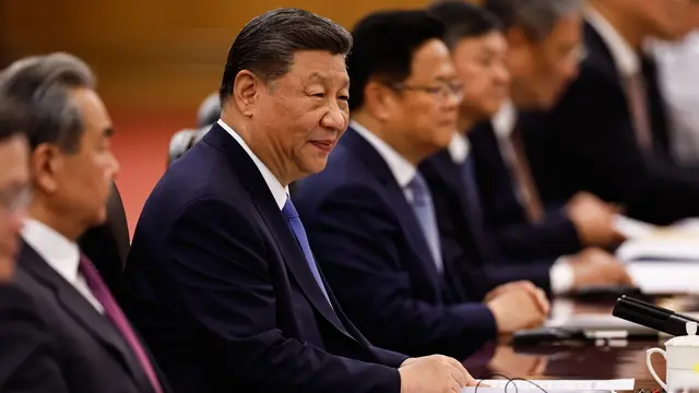epa12096203 Chinese President Xi Jinping (2L) attends a meeting with Brazil's President Luiz Inacio Lula da Silva (not pictured) at the Great Hall of the People in Beijing, China, 13 May 2025. EPA/TINGSHU WANG / POOL
