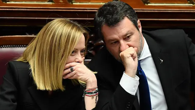 epaselect epa12049447 Italian Prime Minister Giorgia Meloni (L) speaks with Minister of Infrastructure and Transport, Matteo Salvini, during the commemoration of late Pope Francis in the joint Chambers in the Montecitorio Hall in Rome, Italy, 23 April 2025. The spiritual leader died on Easter Monday, 21 April 2025 aged 88. EPA/FABIO CIMAGLIA