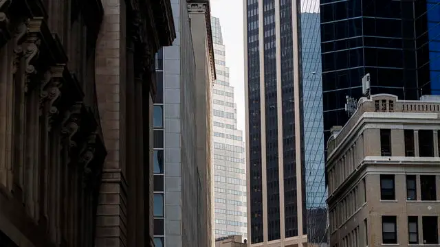 epa08310755 Office buildings are seen in the Financial District in New York, New York, USA, on 20 March 2020. Today, New York Governor Andrew Cuomo issued a statewide shut down of all non-essential businesses and a ban on all non-solitary outside activities that is set begin on Sunday night in a further effort to stop the spread of the coronavirus. EPA/JUSTIN LANE
