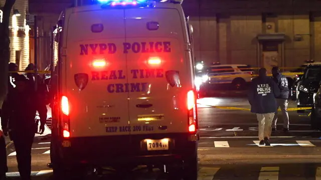 epa11802486 Police comb the scene after multiple gunmen opened fire at people waiting to enter the Amazura nightclub, in the Queens borough of New York, New York, USA, 02 January 2025. According to police, several men opened fire at a group of people waiting outside the venue on 01 January night, which left ten people injured who were taken to area hospitals with non-life-threatening injuries. Authorities said this is not considered a terrorist attack. EPA/LLOYD MITCHELL