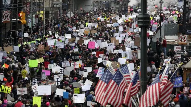 epa05739562 Protesters hold up signs during a Women's March rally on 42nd street in New York, New York , USA, 21 January 2017. Protest rallies were held in over 30 countries around the world in solidarity with the Women's March on Washington in defense of press freedom, women's and human rights following the official inauguration of Donald J. Trump as the 45th President of the United States of America in Washington, DC, USA, on 20 January 2017. EPA/JASON SZENES
