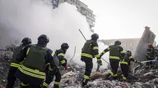 epa11236124 A handout photo made available by the State Emergency Service shows rescuers at work at the scene of a missile strike in the city of Khmelnytskyi, Ukraine, 22 March 2024, amid the Russian invasion. At least two people were killed and eight others were injured in Khmelnytskyi, the State emergency Service reported. According to the Air Force Command of the Armed Forces of Ukraine, Russia has launched projectiles against over 151 targets across Ukraine. The Ukrainian army intercepted 92 of them. EPA/STATE EMERGENCY SERVICE HANDOUT HANDOUT EDITORIAL USE ONLY/NO SALES HANDOUT EDITORIAL USE ONLY/NO SALES