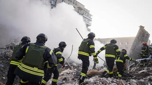 epa11236124 A handout photo made available by the State Emergency Service shows rescuers at work at the scene of a missile strike in the city of Khmelnytskyi, Ukraine, 22 March 2024, amid the Russian invasion. At least two people were killed and eight others were injured in Khmelnytskyi, the State emergency Service reported. According to the Air Force Command of the Armed Forces of Ukraine, Russia has launched projectiles against over 151 targets across Ukraine. The Ukrainian army intercepted 92 of them. EPA/STATE EMERGENCY SERVICE HANDOUT HANDOUT EDITORIAL USE ONLY/NO SALES HANDOUT EDITORIAL USE ONLY/NO SALES