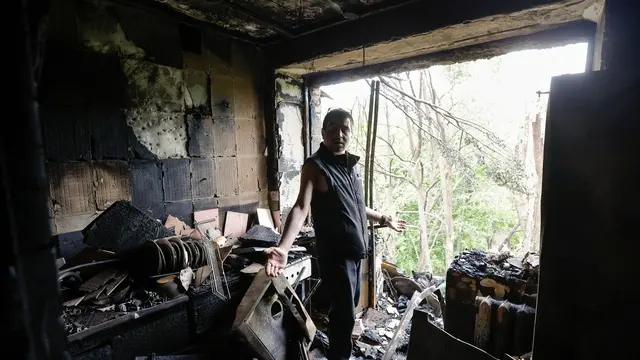 epa12129849 A resident inside his damaged flat in a five-storey residential building struck by a drone in Kyiv, Ukraine, 24 May 2025, amid the ongoing Russian invasion. Nobody was killed, but at least 15 people were injured in overnight strikes on multiple residential areas of Kyiv, according to the State Emergency Service. Russia launched a large-scale attack using at least 14 ballistic missiles and 250 drones across Ukraine. EPA/SERGEY DOLZHENKO