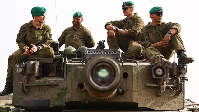 epa11266486 Norwegian soldiers from Telemark battalion sit on a Leopard 2 A4 main battle tank during a NATO military exercise in Gardelegen, Germany, 08 April 2024. Over 90,000 troops from all 32 NATO Allies, including 12,000 from the Bundeswehr, the German armed forces, are participating in the large-scale NATO maneuver 'Steadfast Defender 2024' from January to May 2024. The German contribution to the NATO large-scale exercise is the 'Quadriga 2024,' a series of large-scale combined exercises held in Germany and abroad over a period of five months. EPA/FILIP SINGER