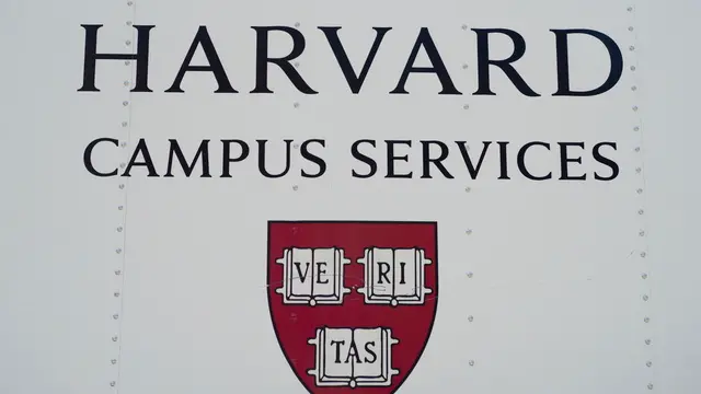 epa12139452 The Harvard University crest adorns the side of a campus services vehicle on the Harvard University campus in Cambridge, Massachusetts, USA, 27 May 2025. US President Trump has instructed all federal agencies to terminate all federal government contracts, estimated to be 100 million dollars (88.2 million euros) with Harvard and its affiliates. EPA/CJ GUNTHER