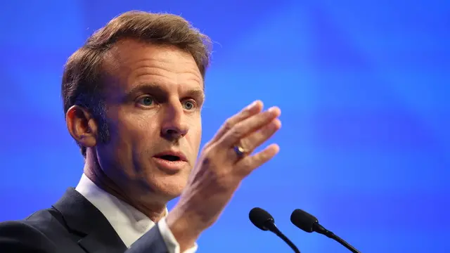 epa12145051 French President Emmanuel Macron delivers his keynote address during the International Institute for Strategic Studies (IISS) Shangri-la Dialogue Defence Summit in Singapore, 30 May 2025. Defense ministers and officials from 47 countries are gathered in the city state for the IISS Shangri-la Dialogue, an annual high level defence summit in the Asia Pacific region. EPA/HOW HWEE YOUNG