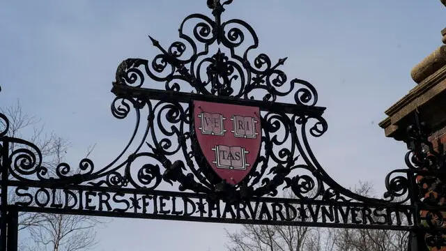 epa12006301 The crest adorns a gate on the campus of Harvard University in Allston, Massachusetts, USA, 02 April 2025. The Department of Education announced on 30 March 2025 that there would be a comprehensive review of contracts and grants at Harvard University and its affiliates, as part of the Joint Task Force to Combat Anti-Semitism. EPA/CJ GUNTHER