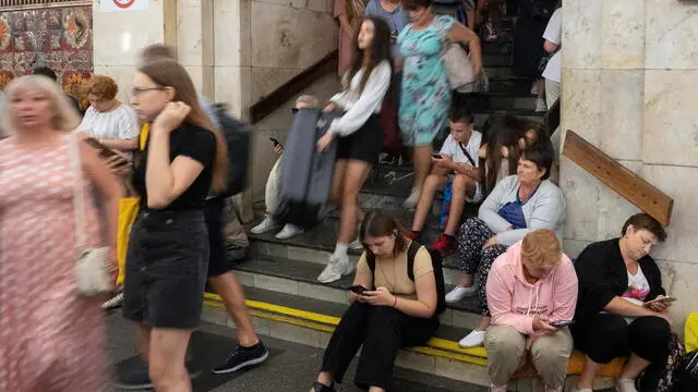 epa11565515 People take shelter from shelling at a metro station in Kyiv, Ukraine, 26 August 2024, after morning combined shelling around all of the territory of Ukraine. Ukrainian President Volodymyr Zelensky wrote on his telegram channel that Ukraine experienced a heavy Russian missile and drone attack. The attack targeted critical civilian infrastructure across the country, resulting in casualties and injuries. The Ukrainian president expressed his condolences to the victims' families and assured that injured people are receiving necessary assistance. Russian troops entered Ukrainian territory on 24 February 2022, starting a conflict that has provoked destruction and a humanitarian crisis. EPA/DANYLO ANTONIUK