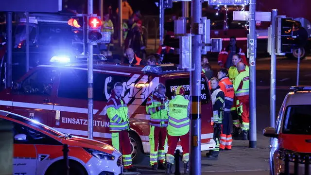 epa11787765 Emergency services at the scene after at least one person was killed and dozens injured after a car was driven into a crowd at the Christmas market in Magdeburg, Germany, 20 December 2024. Eyewitnesses told broadcaster MDR that the car drove straight into the crowd at the market in the direction of the town hall. According to a statement by the Magdeburg police on social media a suspect was taken into custody. EPA/FILIP SINGER