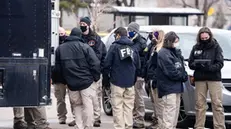 epa09092426 Officials continue to work at the scene a day after Ahmad Al Aliwi Alissa was alleged to have killed ten people including a police officer and is facing ten murder charges at the King Soopers supermarket in Boulder, Colorado, USA, 23 March 2021. Boulder Police released the names of all ten victims as Denny Strong, 20, Neven Stanisic, 23, Rikki Olds, 25, Tralona Bartkowiak, 49, Suzanne Fountain, 59, Teri Leiker, 51, Eric Talley, 51, Kevin Mahoney, 61, Lynn Murray, 62 and Jody Waters, 65. EPA/BRENDAN DAVIS