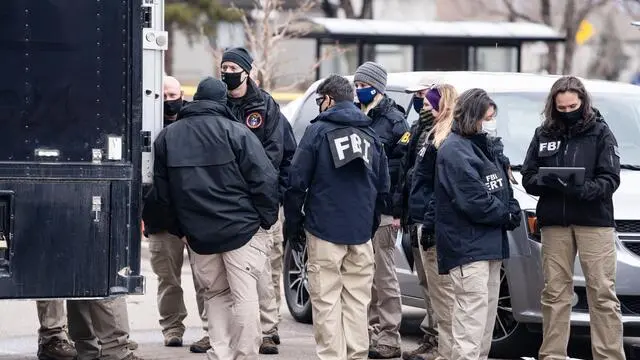 epa09092426 Officials continue to work at the scene a day after Ahmad Al Aliwi Alissa was alleged to have killed ten people including a police officer and is facing ten murder charges at the King Soopers supermarket in Boulder, Colorado, USA, 23 March 2021. Boulder Police released the names of all ten victims as Denny Strong, 20, Neven Stanisic, 23, Rikki Olds, 25, Tralona Bartkowiak, 49, Suzanne Fountain, 59, Teri Leiker, 51, Eric Talley, 51, Kevin Mahoney, 61, Lynn Murray, 62 and Jody Waters, 65. EPA/BRENDAN DAVIS