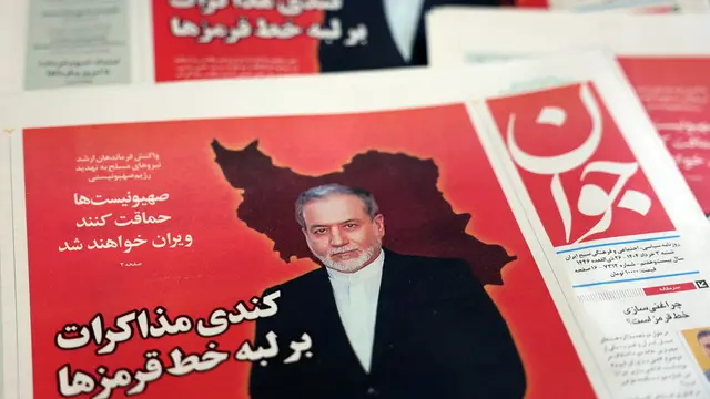 epa12129870 Copies of the Iranian daily newspaper Javan entitled 'The slowdown negotiations over the edge of red lines' carrying a picture of Iranian Foreign Minister Abbas Araghchi, in a kiosk, in Tehran, Iran, 24 May 2025. Iran and the US conducted a fifth round of talks in Rome on 23 May 2025, which Omani Foreign Minister Badr Albusaidi, the mediator of the negotiations, described as concluding 'with some but not conclusive progress.' EPA/ABEDIN TAHERKENAREH