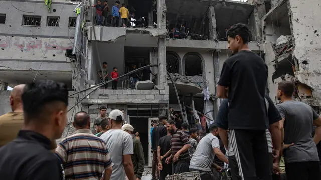 epa12102720 Palestinians inspect the Al-Tawba Medical Clinic building after it was hit by an Israeli airstrike in Jabalia, northern Gaza Strip, 15 May 2025. At least 15 Palestinians were killed in the strike, according to Palestinian news agency WAFA. More than 52,900 Palestinians have been killed in the Gaza Strip, according to the Palestinian Ministry of Health, since Israel launched a military campaign in the strip in response to a cross-border attack led by the Palestinian militant group Hamas on 07 October 2023, in which about 1,200 Israelis were killed and more than 250 taken hostage. EPA/HAITHAM IMAD