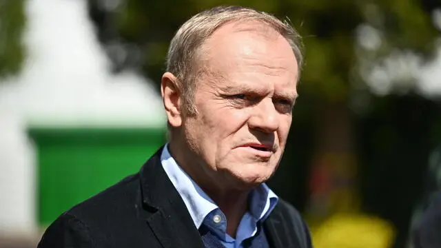 epa12112211 Polish Prime Minister Donald Tusk talks to journalists after his votes at a polling station during Poland's presidential elections in Sopot, Poland, 18 May 2025. Nearly 29 million Poles are eligible to vote in these elections, where 13 candidates are competing to elect their next president for a five-year term. A potential runoff is set for 1 June if no candidate achieves an outright majority in the first round. EPA/MARCIN GADOMSKI POLAND OUT
