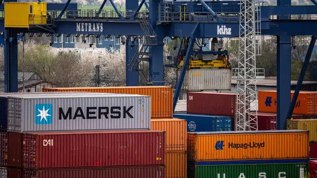 epa12031425 Containers are stacked at a transshipment terminal in Prague, Czech Republic, 14 April 2025. US President Trump initiated a trade war with most of America's trading partners, as several countries were granted a temporary tariffs exemption. EPA/MARTIN DIVISEK