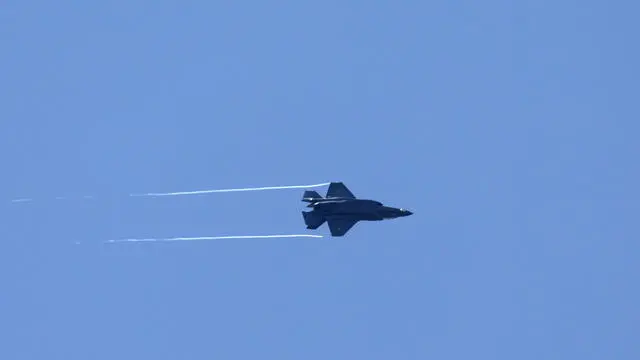 epa11456488 An Israeli F-35 aircraft flies over south Lebanon as seen from northern Israel, 04 July 2024. One day after the death of Muhammad Neamah Naser, the commander of the Hezbollah organization’s Aziz Unit, in an Israeli strike on southern Lebanon, the Israeli army reported on 04 July that its fighter jets struck more Hezbollah targets, including a military structure in the area of Chihine and three infrastructure sites in the area of Blat. In addition, more than 100 launches fired from Lebanon were identified, they added. EPA/ATEF SAFADI
