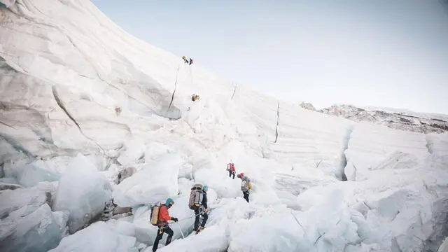 epa11334454 A handout photo made available by Seven Summit Trek shows climbers on a glacier at a base camp, 5,364 m (17,598 ft) above sea level, of Mt. Everest in Nepal, 26 April 2024 (issued 12 May 2024). According to Seven Summit Trek, Nepalese climber Kami Rita Sherpa broke his own record on 12 May 2024 after successfully climbing Mt Everest for the 29th time. EPA/SEVEN SUMMIT TREK / HANDOUT HANDOUT EDITORIAL USE ONLY/NO SALES HANDOUT EDITORIAL USE ONLY/NO SALES