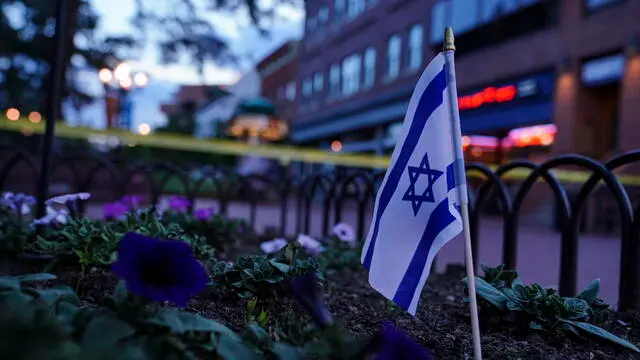 epa12150110 An Israeli flag in a flowerbed near the scene of an incident in Boulder, Colorado, USA, 01 June 2025. Boulder police stated in a press conference that six members of the public have been injured in what the FBI has described as a 'targeted terror attack'. EPA/REBECCA SLEZAK