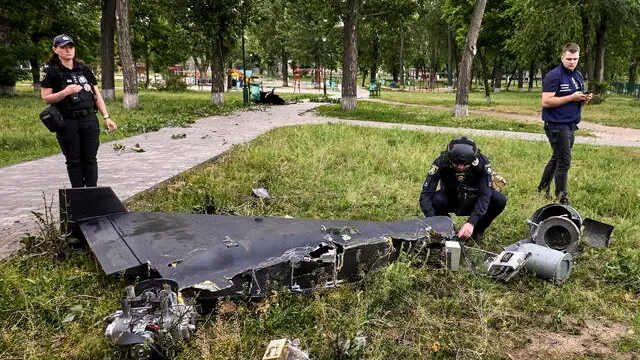 epaselect epa12154155 Ukrainian experts inspect debris at the site of a drone strike in Kharkiv, northeastern Ukraine, 04 June 2025, amid the Russian invasion. At least one person was injured and large-scale fires broke out in industrial zones after Russian forces launched an overnight attack on Kharkiv using nine 'Shahed' drones and two missiles, Kharkiv Mayor Ihor Terekhov wrote on telegram. EPA/SERGEY KOZLOV