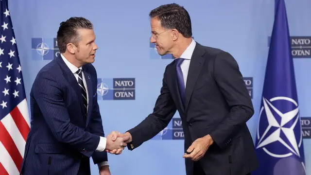 epa12156644 NATO Secretary General Mark Rutte (R) welcomes US Secretary of Defense Pete Hegseth (L) prior to a North Atlantic Treaty Organisation (NATO) defense ministers meeting at the NATO headquarters in Brussels, Belgium, 05 June 2025. EPA/OLIVIER MATTHYS