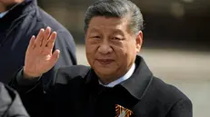 epa12085993 Chinese President Xi Jinping gestures as he walks in Red Square after the Victory Day military parade in Moscow, Russia, 09 May 2025. Russia marks the 80th anniversary of the victory in World War II over Nazi Germany and its allies. The Soviet Union lost 27 million people in the war. EPA/PAVEL BEDNYAKOV / POOL