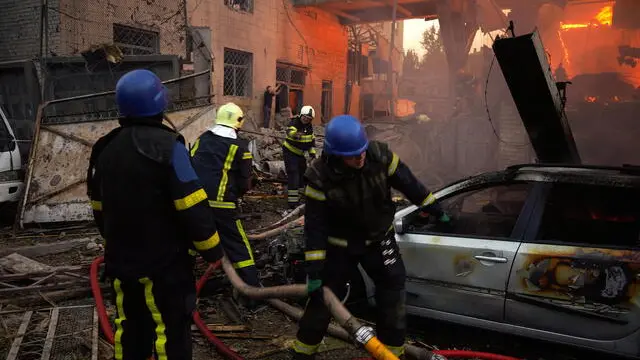 epa10828165 Firefighters work at the site of a missile strike in Kyiv (Kiev), Ukraine, 30 August 2023. Russian forces attacked Kyiv the night of 30 August killing two people and injuring another, Kyiv City Military Administration Head Serhii Popko reported. Russian troops entered Ukrainian territory in February 2022, starting a conflict that has provoked destruction and a humanitarian crisis. EPA/VADYM SARAKHAN