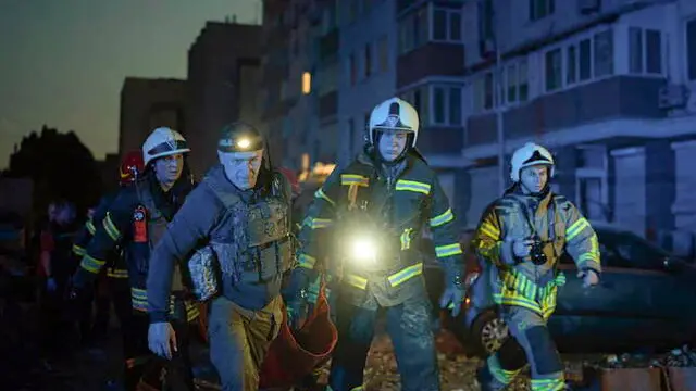 epa10662956 A handout photo released by the press service of the State Emergency Service (SES) of Ukraine shows rescuers at the site of a damaged apartment building after a drone strike in Kyiv (Kiev), Ukraine, 30 May 2023, amid the Russian invasion. At least one person died and three others were injured after a fire broke out in a multi-story building in the Ukrainian capital as a result of falling debris during a Russian strike, the Kyiv City Military Administration said on telegram. On 30 May Russian forces launched 31 'kamikaze' drones on Ukraine, 29 of which were shot down, said the Air Force Command of the Armed Forces of Ukraine. Russian troops entered Ukrainian territory in February 2022, starting a conflict that has provoked destruction and a humanitarian crisis. EPA/STATE EMERGENCY SERVICE OF UKRAINE HANDOUT -- BEST QUALITY AVAILABLE -- MANDATORY CREDIT: STATE EMERGENCY SERVICE OF UKRAINE -- HANDOUT EDITORIAL USE ONLY/NO SALES