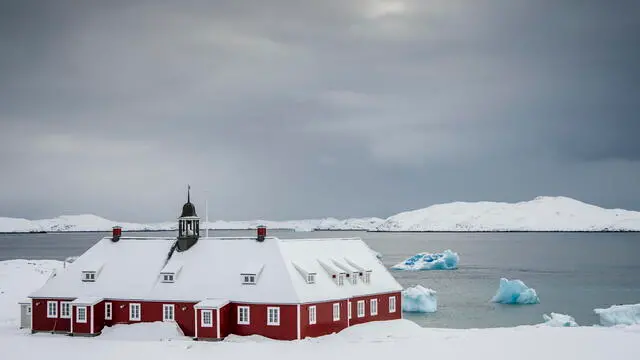 epa11964765 A church building and large pieces of ice on a beach in Nuuk, Greenland, 14 March 2025. EPA/MADS CLAUS RASMUSSEN DENMARK OUT