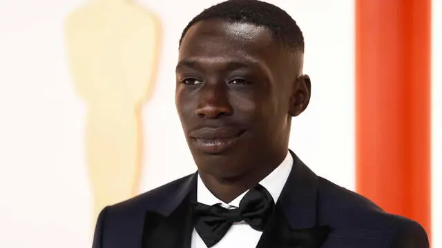 epa10517647 Khabe Lame, a Senegalese-born Italian Tik Tok personality, arrives for the 95th annual Academy Awards ceremony at the Dolby Theatre in Hollywood, Los Angeles, California, USA, 12 March 2023. The Oscars are presented for outstanding individual or collective efforts in filmmaking in 24 categories. EPA/CAROLINE BREHMAN
