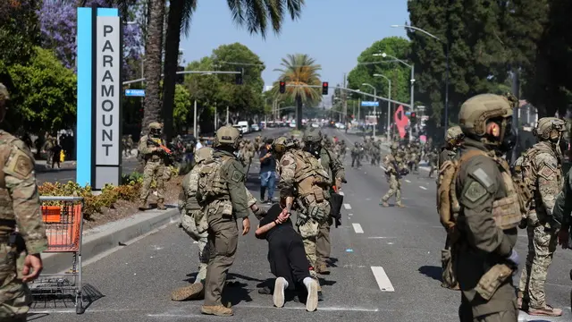 epa12163166 A protester is arrested during a clash with federal agents near a Home Depot after a raid was conducted by Immigration and Customs Enforcement (ICE) in Paramount, California, USA, 07 June 2025. This comes the day after federal immigration authorities arrested more than 40 people across Los Angeles, as protesters gathered outside a federal detention center. EPA/ALLISON DINNER