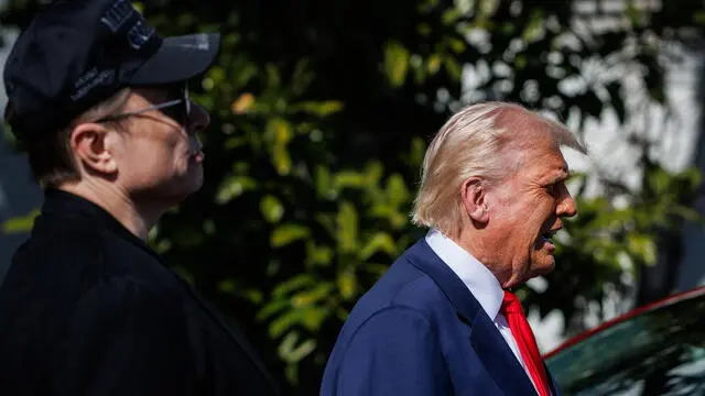 epa11957117 US President Donald Trump (R) speaks in front of a group of Tesla vehicles with Tesla CEO and Senior Advisor to the President of the United States Elon Musk (L) and his son, X, on the South Lawn of the White House in Washington, D.C., USA, 11 March 2025. President Trump has said he will buy a Tesla to support Tesla and Elon Musk after recent attacks on Tesla charging stations and calls for boycotts of Tesla products. EPA/SAMUEL CORUM / POOL