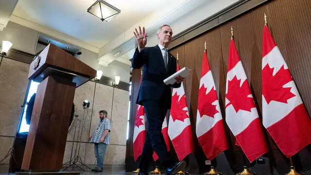 epa11992821 Canadian Prime Minister Mark Carney speaks during a press conference on proposed US tariffs on Parliament Hill in Ottawa, Canada, 27 March 2025. EPA/SPENCER COLBY