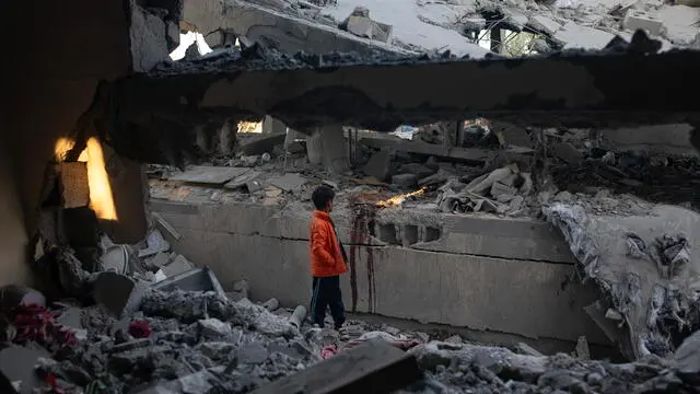 epa11812643 A Palestinian boy inspects the rubble of a destroyed building following an Israeli airstrike in the Khan Yunis camp in southern Gaza, 08 January 2025. At least 20 Palestinians were killed following an Israeli airstrike targeting residential areas in Khan Younis, according to medics at Nasser Hospital. More than 45,800 Palestinians and over 1,400 Israelis have been killed, according to the Palestinian Health Ministry and the Israeli Army, since Hamas militants launched an attack against Israel from the Gaza Strip on 07 October 2023, and the Israeli operations in Gaza and the West Bank which followed it. EPA/HAITHAM IMAD