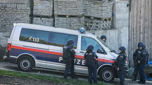 epa11688885 Austrian police officers near the scene of a shooting incident in Kirchberg ob der Donau, Austria, 28 October 2024. Police in Kirchberg ob der Donau in the northern Austrian state of Upper Austria have been conducting a major operation since the morning of 28 October 2024. A spokeswoman for the state police confirmed that a man is suspected of having shot dead two people, including the mayor of Kirchberg. The suspect is still on the run. EPA/ANTONIO BAYER