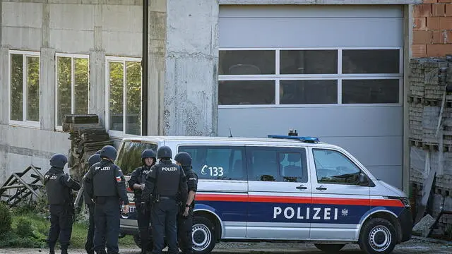 epa11688886 Austrian police officers near the scene of a shooting incident in Kirchberg ob der Donau, Austria, 28 October 2024. Police in Kirchberg ob der Donau in the northern Austrian state of Upper Austria have been conducting a major operation since the morning of 28 October 2024. A spokeswoman for the state police confirmed that a man is suspected of having shot dead two people, including the mayor of Kirchberg. The suspect is still on the run. EPA/ANTONIO BAYER