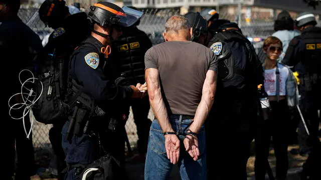 epa12169436 A protestor is detained during protests sparked by immigration raids in Los Angeles, California, USA, 10 June 2025. US President Donald Trump has deployed 2,000 National Guard troops, despite not receiving a request from the state of California for any additional assistance, following large protests against ongoing immigration enforcement raids in the Los Angeles area over the last few days. EPA/CAROLINE BREHMAN