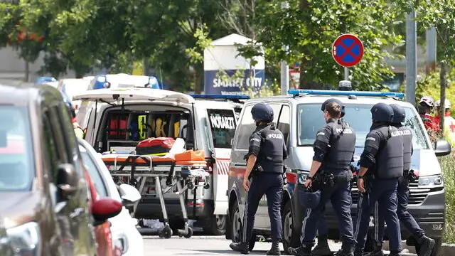 epa12167778 Police and medical personnel outside the Dreierschützengasse high school following a shooting in Graz, Austria, 10 June 2025. At least nine people were killed in the incident, including the shooter, authorities confirmed. EPA/ERWIN SCHERIAU