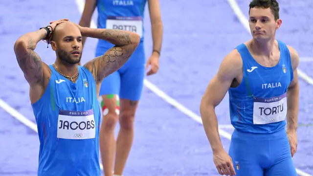 Italy's Filippo Tortu and Lamont Marcell Jacobs react after the Men's 4x100m Relay final of the Athletics competitions in the Paris 2024 Olympic Games, at the Stade de France stadium in Saint Denis, France, 09 August 2024 ANSA/ETTORE FERRARI