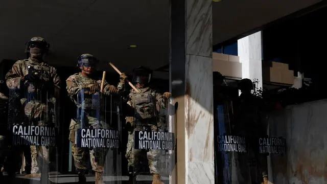 epa12169439 National Guard officers stand outside the Edward R. Roybal Federal Building in Los Angeles, California, USA, 10 June 2025. US President Donald Trump has deployed 2,000 National Guard troops, despite not receiving a request from the state of California for any additional assistance, following large protests against ongoing immigration enforcement raids in the Los Angeles area over the last few days. EPA/CAROLINE BREHMAN