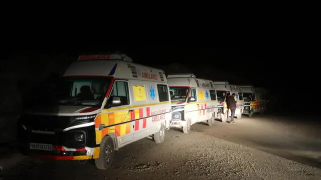 epa10993105 Ambulances stand near the site of a tunnel collapse on the Brahmakal Yamunotri National Highway in Uttarkashi, India, 24 November 2023. Rescue and relief operations were underway as 40 workers remained trapped after an under-construction tunnel collapsed on 12 November 2023. The workers were expected to be rescued on 24 November but the rescue work was halted due to some technical glitch. EPA/HARISH TYAGI