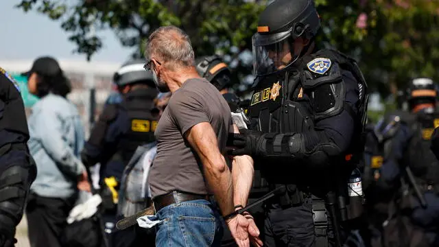 epa12169450 California Highway Patrol (CHP) officers detain protesters in Los Angeles, California, USA, 10 June 2025. US President Donald Trump has deployed 2,000 National Guard troops, despite not receiving a request from the state of California for any additional assistance, following large protests against ongoing immigration enforcement raids in the Los Angeles area over the last few days. EPA/CAROLINE BREHMAN