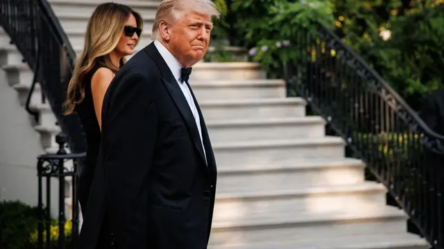 epa12170758 US President Donald J. Trump and First Lady Melania Trump (back L) walk out of the South Portico towards the Beast as they head for the opening night of Les Miserables at the Kennedy Center in Washington, DC, USA, on June 11, 2025. EPA/Samuel Corum/Sipa USA