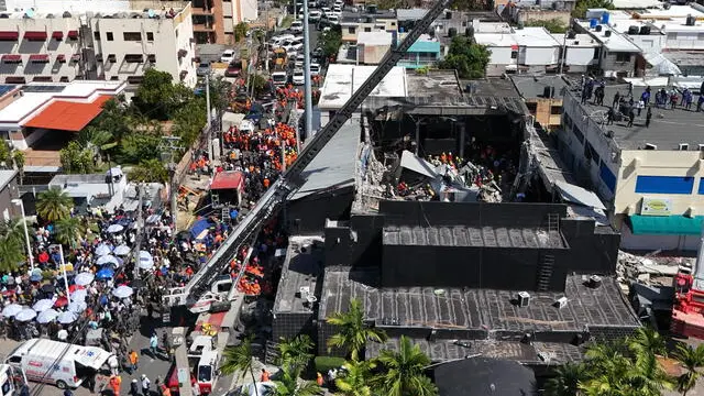 epa12018872 A general aerial view showing members of the fire and rescue services as they work at the scene after the collapse of the Jet Set Club's roof (C) in Santo Domingo, Dominican Republic, 08 April 2025. The death toll from the collapse of the roof of a popular discotheque in the Dominican capital has risen to 44, while the number of injured is over a hundred and there is an undetermined number of people trapped in the rubble, according to the latest provisional data from the Emergency Operations Center (COE). EPA/XP3 GROUP