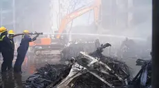 epa12171314 Firefighters work at the site of a plane crash near Sardar Vallabhbhai Patel International Airport in Ahmedabad, Gujarat, western India, 12 June 2025. Air India flight AI171, bound for London carrying 242 passengers and crew members on board a Boeing 787-8 aircraft, crashed minutes after take-off in the Meghaninagar area of Ahmedabad. EPA/SIDDHARAJ SOLANKI
