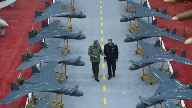 epa11821633 A handout picture made available by the Iranian army office shows Commander-in-Chief of Iran's Army, Abdolrahim Mousavi (L), and Iranian Defense Minister Aziz Nasirzadeh (R) inspecting the drones during an inauguration ceremony of 1000 new drones joining the Iranian Army in Tehran, Iran, 13 January 2025. EPA/HANDOUT HANDOUT EDITORIAL USE ONLY/NO SALES