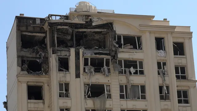 epa12173182 A damaged building that was hit by Israeli air strikes, north of Tehran, Iran, 13 June 2025. Israel launched strikes on Iran and its capital Tehran early 13 June, killing top military figures, including Armed Forces Chiefs of Staff Mohammad Bagheri and Chief Commander of the Islamic Revolutionary Guard Corps (IRGC) Hossein Salami, both countries confirmed. The strikes were part of Operation Rising Lion, Israel's Prime Minister Netanyahu said, adding that Iran's nuclear programme poses a threat to 'Israel's very survival.' EPA/ABEDIN TAHERKENAREH